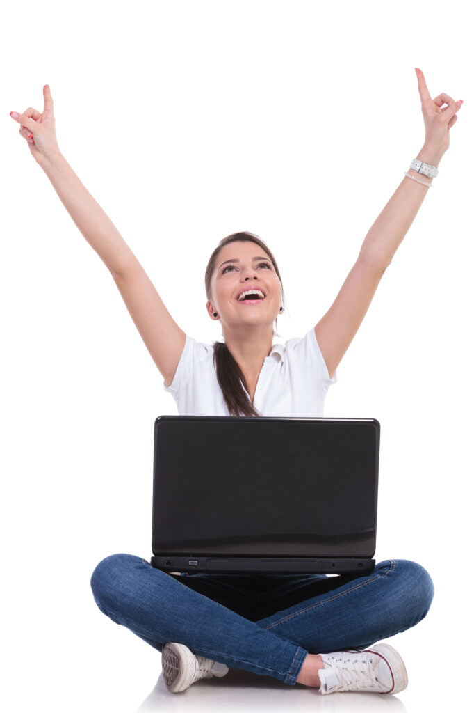 casual woman sits & cheers with laptop Residential Computer Repair Provo